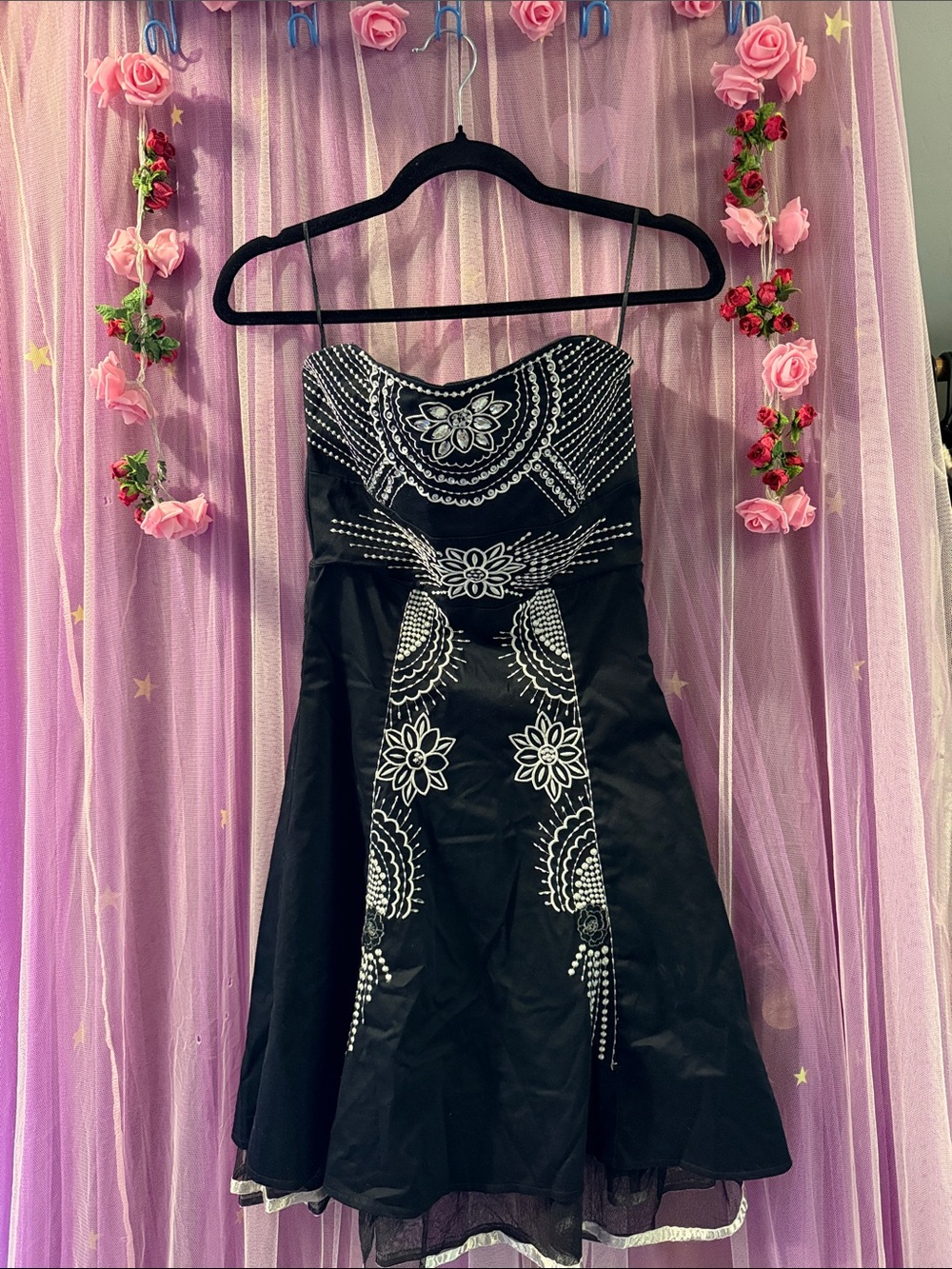 Woman’s strapless embroidered party dress